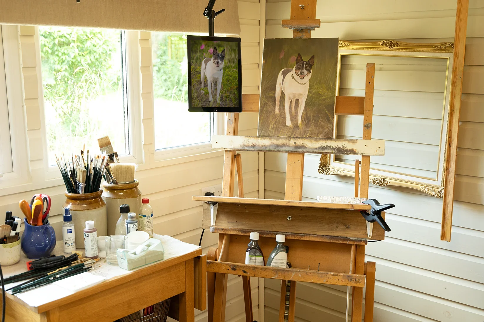 Mounted iPad for Viewing Reference Photos in the Studio Nicholas’s iPad mounted to a studio beam, used for displaying large reference photos at eye level while painting.
